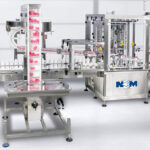 New England Machinery's Rotary Cap Applicator in action