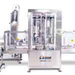 Rotary Chuck Bottle Capper | The NEM capper can run the highest speeds in the industry.