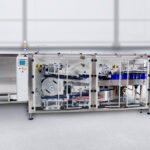 Low Profile Unscrambler with integrated Bottle Orienter