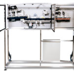 Bottle Uprighter | Designed to upright neck-trailing containers lying on their minor axis.