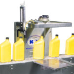 Inspection Rejection System | Inspects for skewed caps, missing caps or foil liners. It can detect down bottles or mis-oriented bottles